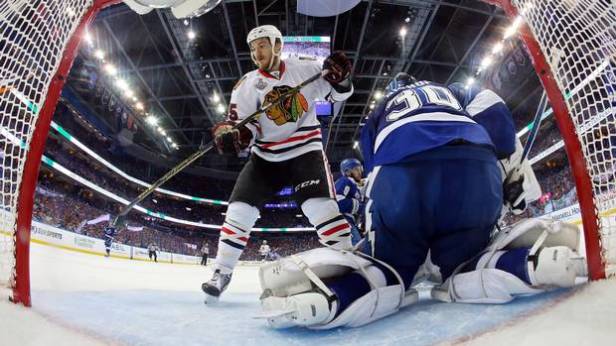 Ben Bishop of the Lightning tends goal against Andrew Shaw of the Blackhawks during Game Five of the 2015 NHL Stanley Cup Final at Amalie Arena on June 13, 2015 in Tampa, Florida. (Bruce Bennett/Getty Images)