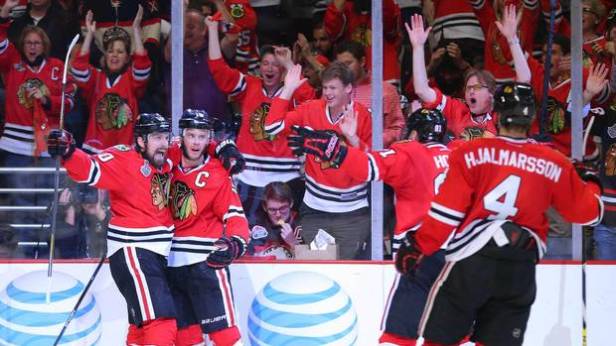 Chicago Blackhawks centre Jonathan Toews (19) celebrates with teammates Patrick Sharp (10) , Marian Hossa (81) and Niklas Hjalmarsson (4) after scoring a goal against the Tampa Bay Lightning in the second period of game four of the 2015 Stanley Cup Final at United Center. (Dennis Wierzbicki/USA Today Sports)